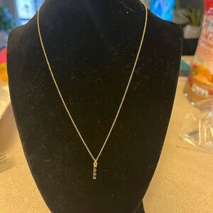 DOGEARED GOLD NECKLACE WITH BLACK VERTICAL BAR PENDANT